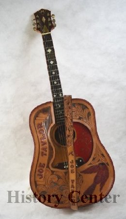 Joe Taylor's Guitar, Leather Decorative Case, and Strap