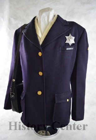 Officer Moser's FWPD uniform, badge, and gunpurse, c. 1940s